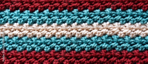 Capture the intricate beauty of a red, white, and blue crocheted pattern in a detailed closeup. The creative arts come to life in this stunning display of colors and shapes © 2rogan