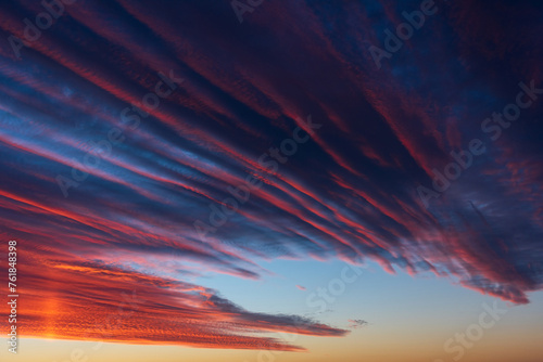 Obraz na płótnie Stunningly beautiful multi-colored violet-pink-lilac evening sky, multi-colored clouds fan out from the lower horizon w salonie