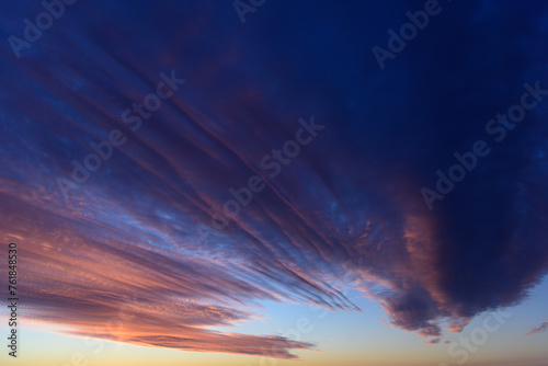 Obraz na płótnie Stunningly beautiful multi-colored violet-pink-lilac evening sky, multi-colored clouds fan out from the lower horizon w salonie