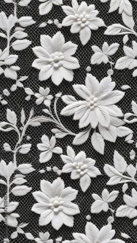  white lace pattern with beads against black background, floral design. concepts: textile backgrounds and textures, elegant fabrics, bridal lace, romantic lace, handmade, backdrop for elegant themes photo