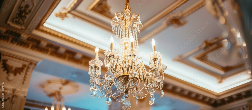 Luxurious chandelier hanging from the ceiling.