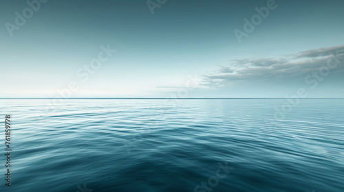 A calm and peaceful ocean with a clear blue sky above