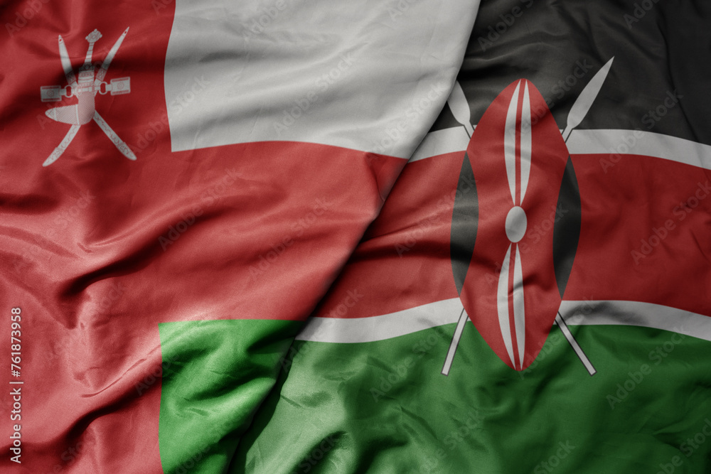 big waving national colorful flag of kenya and national flag of oman.