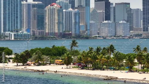 Hobie Island Beach Park on Virginia Key and Miami Brickell downtown in Florida, USA. Commercial and residential skyscraper buildings in modern US megapolis. photo