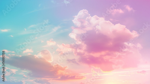 Pastel sky landscape with mix of pink, blue, yellow colors and fluffy, white clouds and the sun is shining brightly in the background.