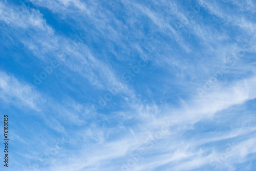 gentle cirrus clouds in a bright blue sky