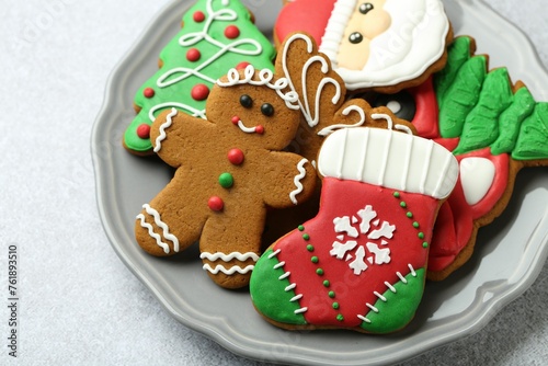 Tasty homemade Christmas cookies on light grey table, closeup