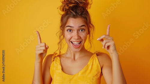 Photo of impressed excited woman wear cow skin top pointing two fingers empty space isolated yellow color background photo