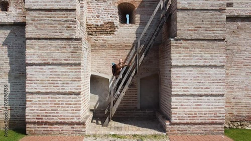 climbing up steep stairs in meddieval city walls way to success travel photo