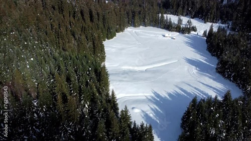 Riofreddo Valley from above. Tarvisiano in winter clothes between snow and frost. photo