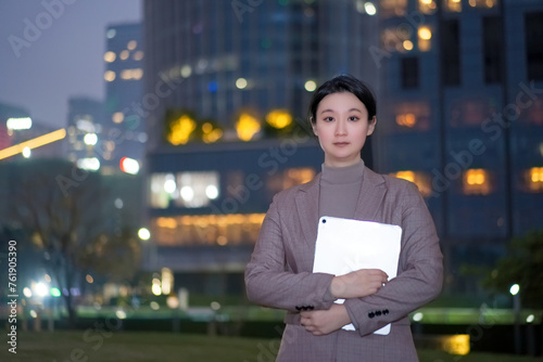 Confident Professional Holding Tablet Outdoors