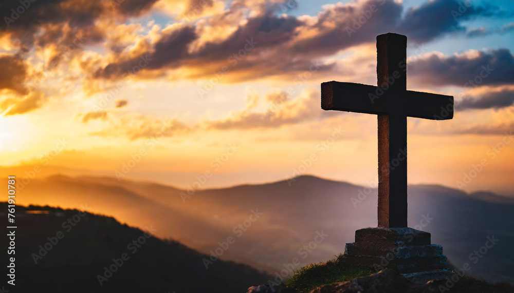 Silhouette of Holy Cross against dramatic sky, symbolizing Jesus Christ's death and resurrection