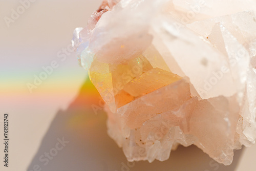 Luminous Quartz with Rainbow Flares. Sun's rays interact with quartz stone, iridescent rainbow glares, background with shining crystal at sunlight, aesthetic view with natural light effect