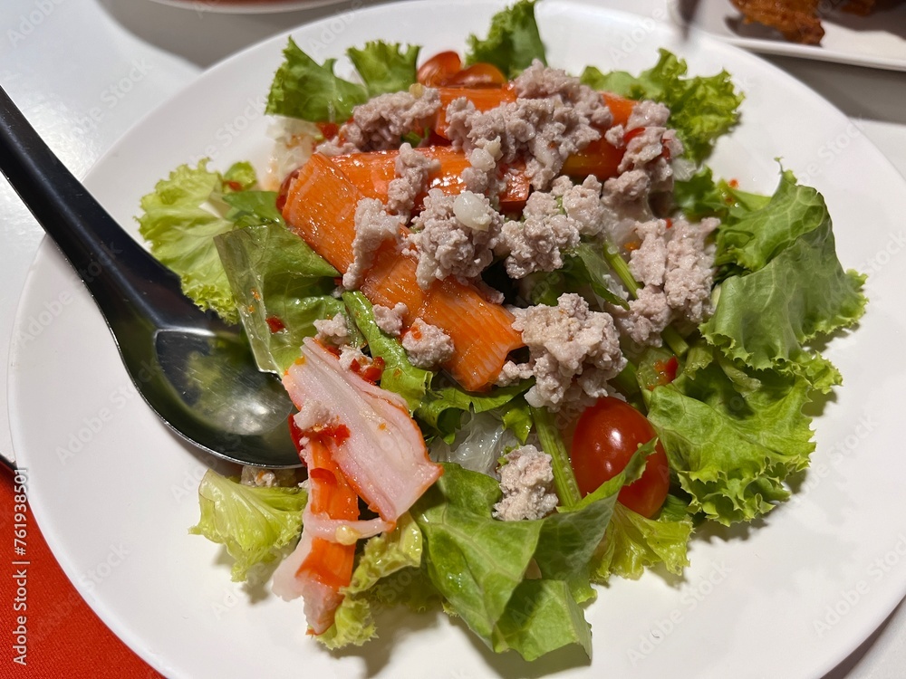 Traditional Spicy minced pork and fresh vermicelli salad serving on the plate. Famous appetizer and starter menu in local restaurant. Traditional Spicy minced pork and fresh vermicelli salad serving on the plate. Famous appetizer and starter menu in local restaurant.