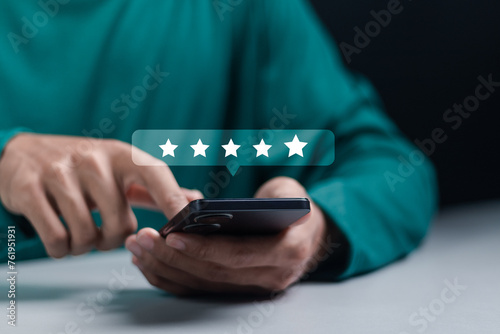 Customer satisfaction survey concept. Service experience rating, Satisfaction feedback review, good quality most. Person use smartphone to give excellent five-star ratings on virtual screen.