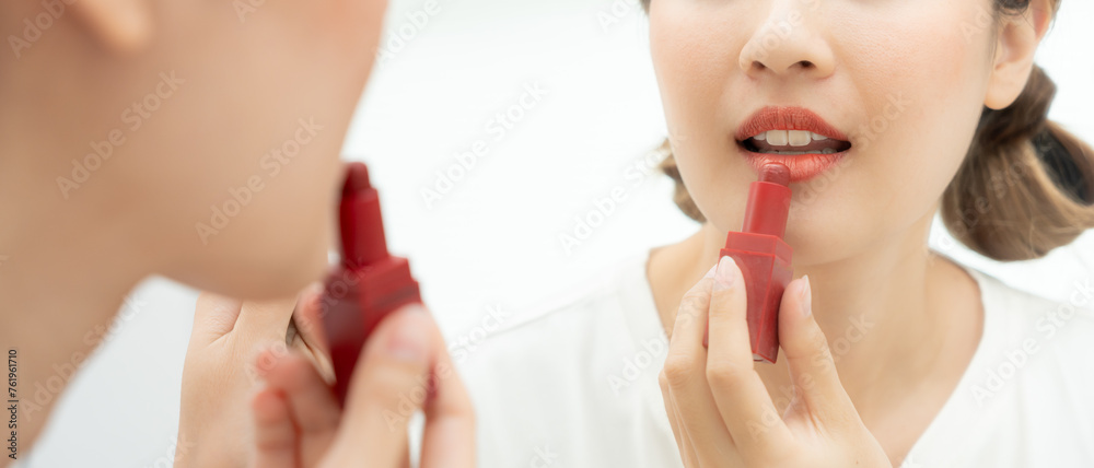 Beautiful Asian woman sit in front of a mirror and smile on makeup. face of a healthy woman applying makeup. Advertisement, lifestyle , cosmetics, makeup accessories, beauty activity, beautician Beautiful Asian woman sit in front of a mirror and smile on makeup. face of a healthy woman applying makeup. Advertisement, lifestyle , cosmetics, makeup accessories, beauty activity, beautician