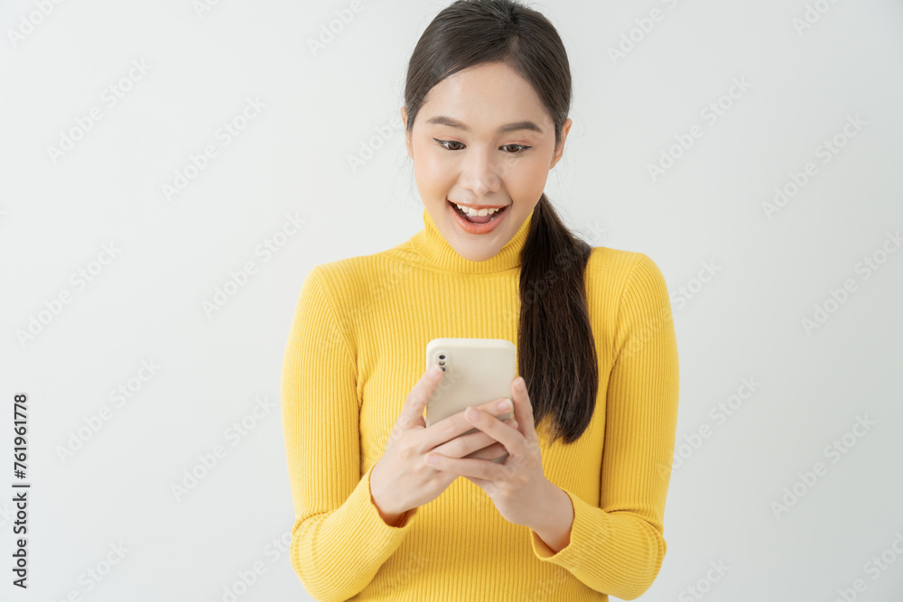 Asian beautiful woman exited surprise face expression . female feels shocked with the phone. exciting smile and happy adorable rejoices. Very enjoy and fun relax time. wow, girl holding smartphone.. Asian beautiful woman exited surprise face expression . female feels shocked with the phone. exciting smile and happy adorable rejoices. Very enjoy and fun relax time. wow, girl holding smartphone..
