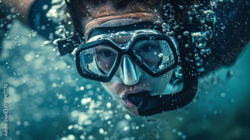 A closeup of a divers face as they gracefully twist and turn through the air.