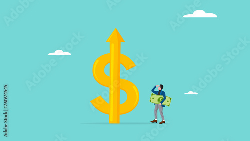 increased business income or investment dividends with businessman looking at high rising up graph arrow while carrying banknotes