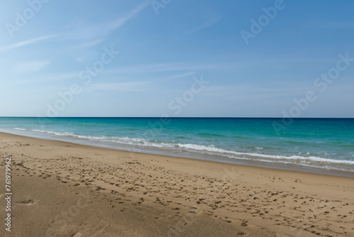 Beautiful sandy beach and turquoise sea under the blue sky