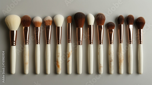 Elegant White Marble Handled Makeup Brushes With Copper Detailing Displayed