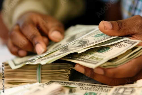 A person holding a stack of money in their hands, symbolizing financial success and achievement