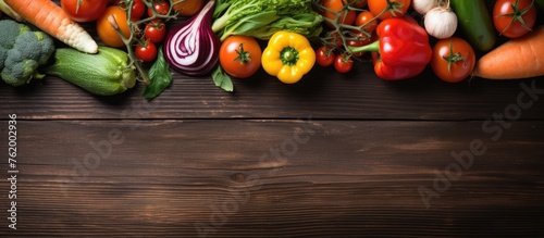 Assorted Fresh Vegetables Arranged on Rustic Wooden Background for Healthy Cooking Concept