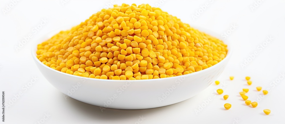 Bowl of corn, spoon, and seeds Bowl of corn, spoon, and seeds
