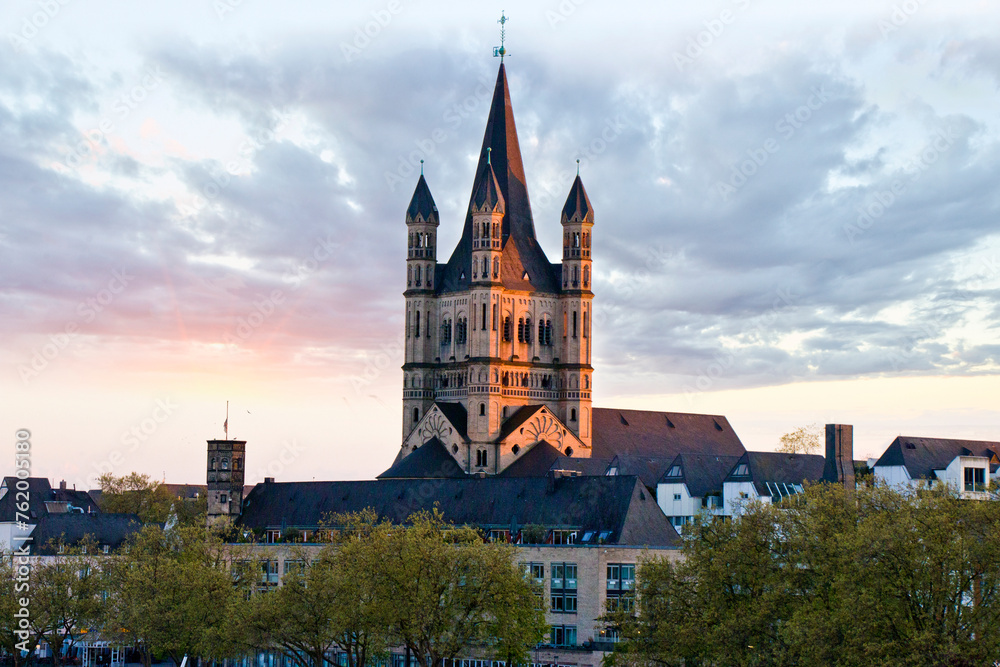 Riverside promenade and Saint Martin church in Cologne, Germany.