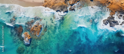 Aerial view of rocky beach by a body of water