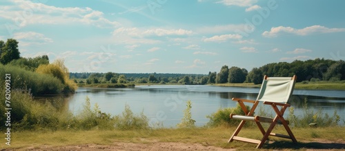 Solitude Chair by Lake: Quiet Contemplation and Serenity on Nature's Edge © Ilgun