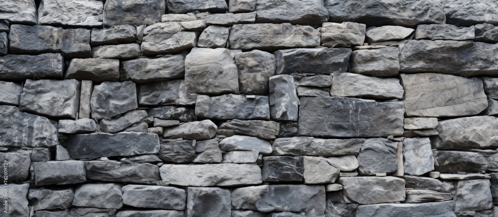 Rugged Stone Wall Texture Against a Darkened Background for Dramatic Design