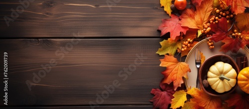 Rustic Thanksgiving Table Decor with Pumpkins, Autumn Leaves and Elegant Candles
