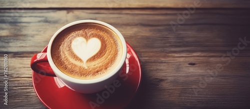Coffee cup with heart symbol photo