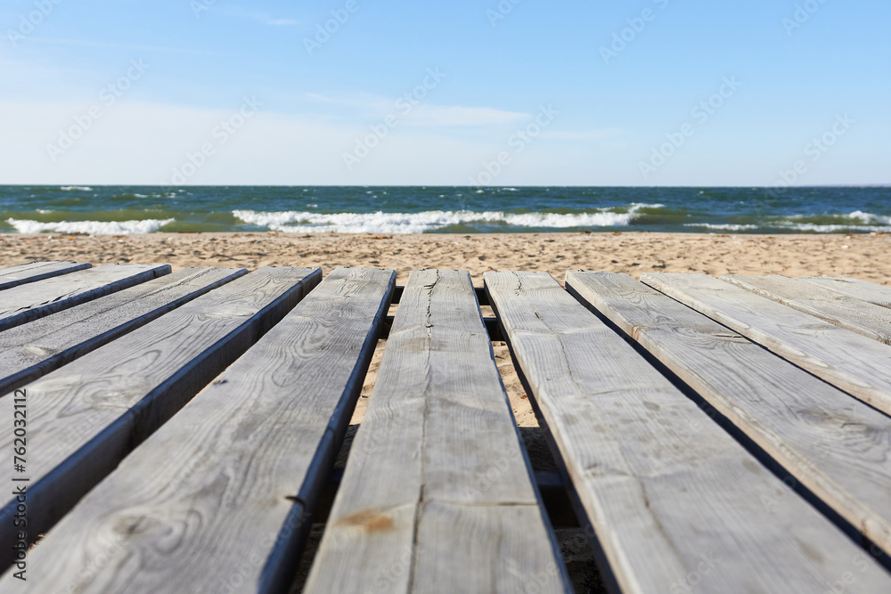 Fototapeta premium Wooden decking on the beach. Beautiful natural wallpaper.