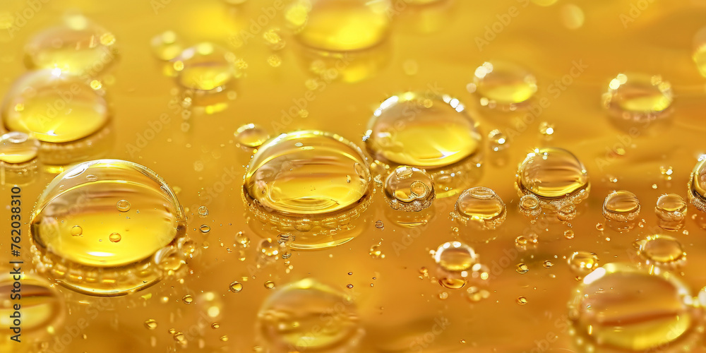 gold oil bubbles in yellow oil liquid background, banner
