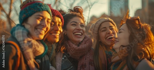An authentic moment among a group of diverse friends sharing laughter and happiness as the sun sets behind the city skyline, highlighting the beauty of friendship and diversity.
