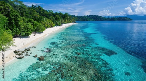 Top view of white sandy beach with clear blue water