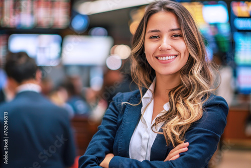 Hispanic business woman in blue formal wear on trading floor, finance stock