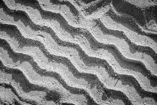 Tire tracks on the sand of Sant Pol de Mar beach, in the province of Barcelona (Spain)