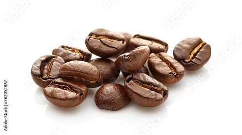 Close up of roasted coffee beans with rich texture against a white background