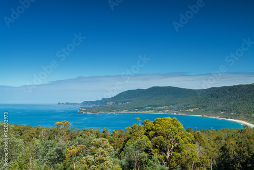 Beautiful coastal scenery in Tasmania  Cliffs and turquoise waters merge  framed by rugged shorelines and pristine beaches  a captivating blend of nature s wonders