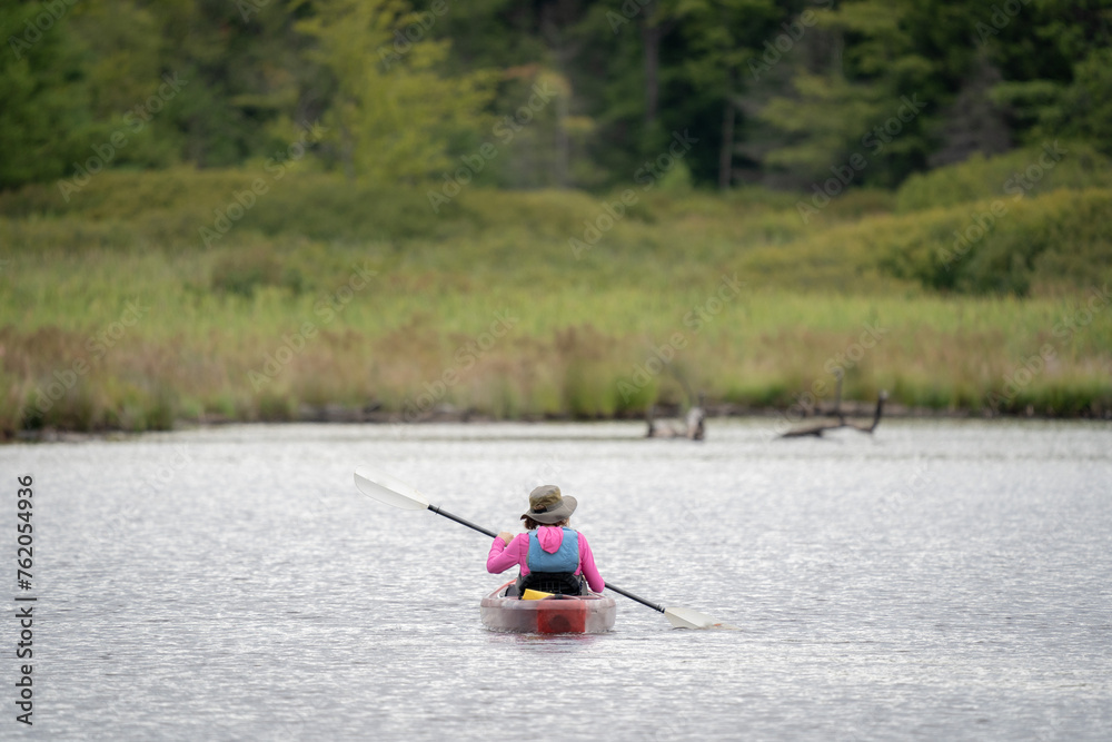 Person Kayaking in a Lake