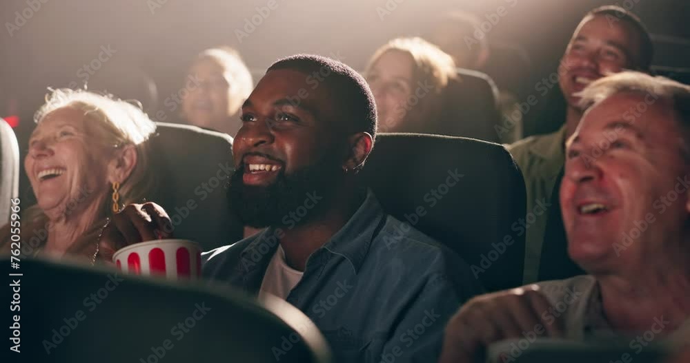 People, audience and cinema or laughing at movie for comedy film festival, performance or entertainment. Man, popcorn and humor in auditorium theatre or chair rows for watching, screening or funny