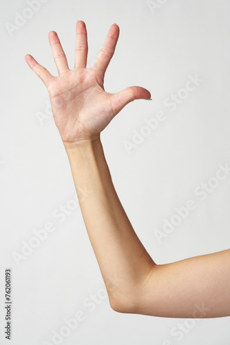Human hand showing the five fingers isolated on a white background