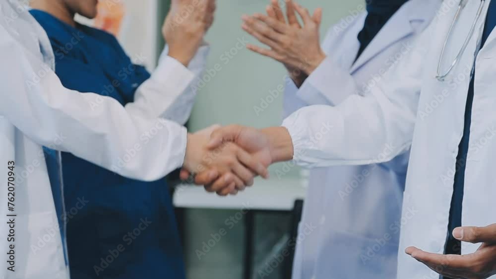 A handshake between an MR and a doctor who comes to the hospital on a sales call and shakes hands to seal the deal. Faceless scene. A handshake between an MR and a doctor who comes to the hospital on a sales call and shakes hands to seal the deal. Faceless scene.