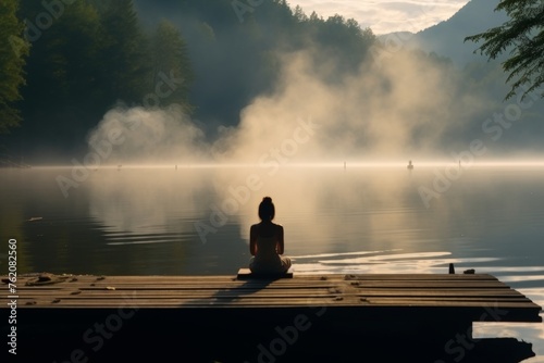 Woman meditating in yoga pose, back view for relaxation, mindfulness practice and inner peace