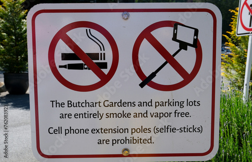 Sign indicating a ban on smoking and taking pictures with a selfie stickThe famous gardens of Butchert on Victoria Island. Canada. The Butchart Gardens photo