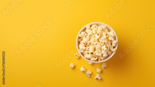 popcorn on a yellow background © nomesart