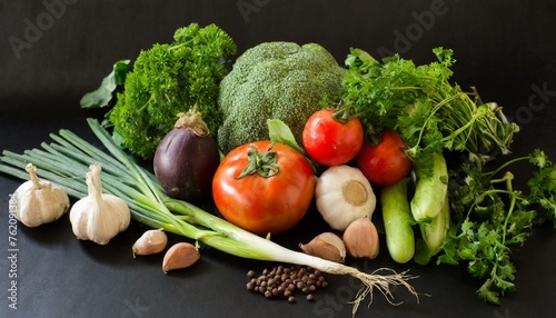 Bountiful Harvest: Organic Vegetables Set Against Black Background